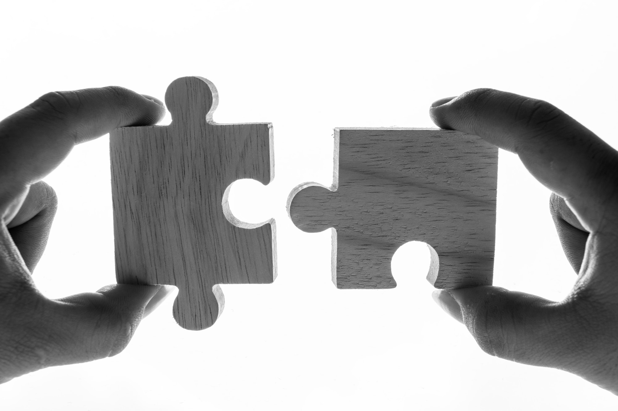 Macro shot of jigsaw puzzles teamwork concept