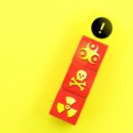 colored cubes with toxic or chemical icons and caution